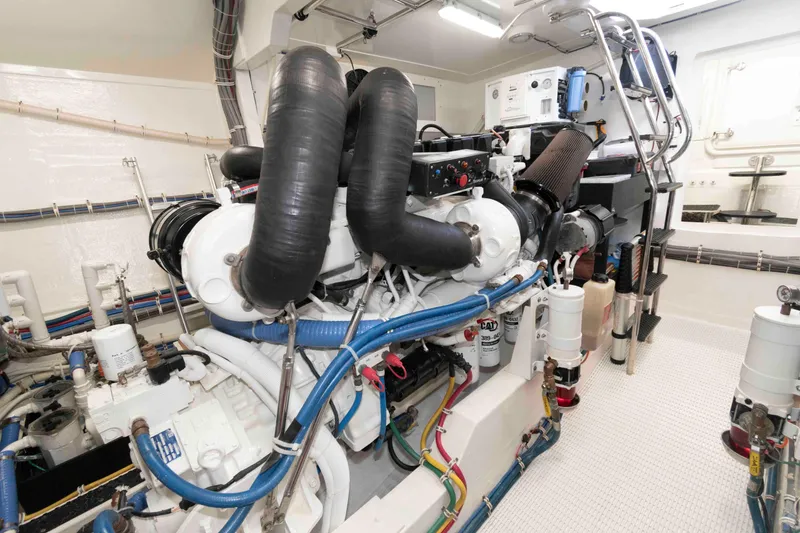 Slide: The Image of Engine room of 2009 Hatteras 60 Motor Yacht with complex machinery and piping. - 77