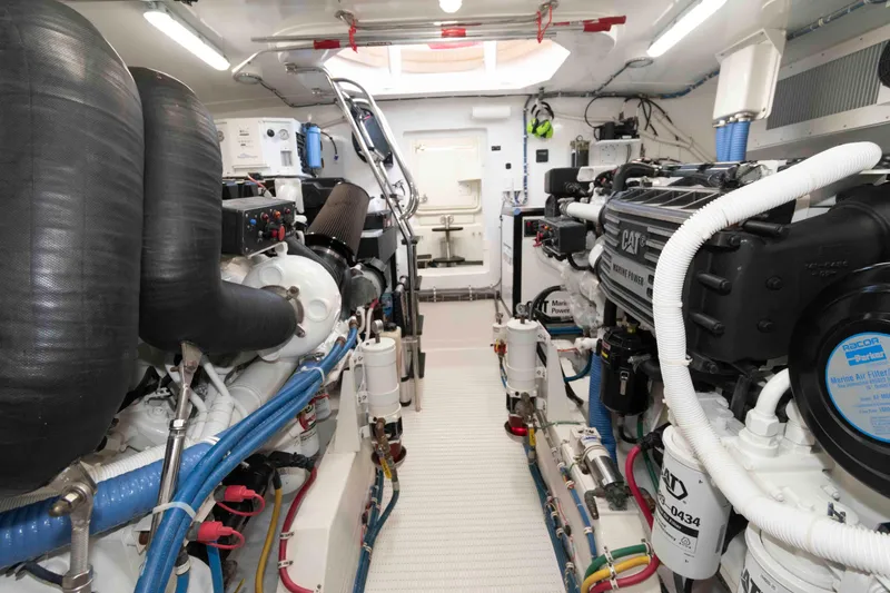 Slide: The Image of Engine room of 2009 Hatteras 60 Motor Yacht, featuring advanced marine power systems. - 79