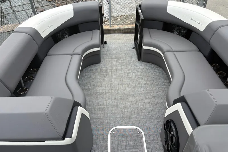 Slide: The Image of 2023 South Bay 525 RS 3.0 Arch pontoon boat with gray seating and cup holders. - 10