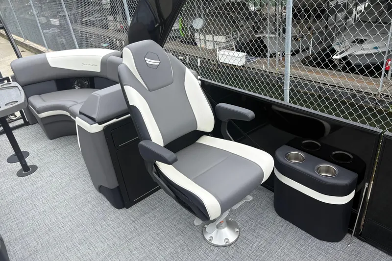 Slide: The Image of Luxurious seating on 2023 South Bay 525 RS 3.0 Arch boat, featuring modern design and cup holders. - 11