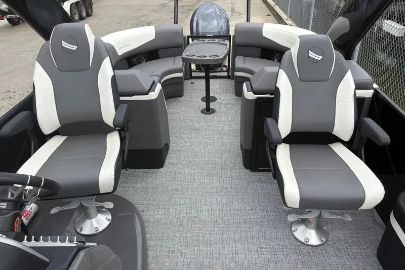 Slide: The Image of 2023 South Bay 525 RS 3.0 Arch boat interior with gray and white seating. - 18