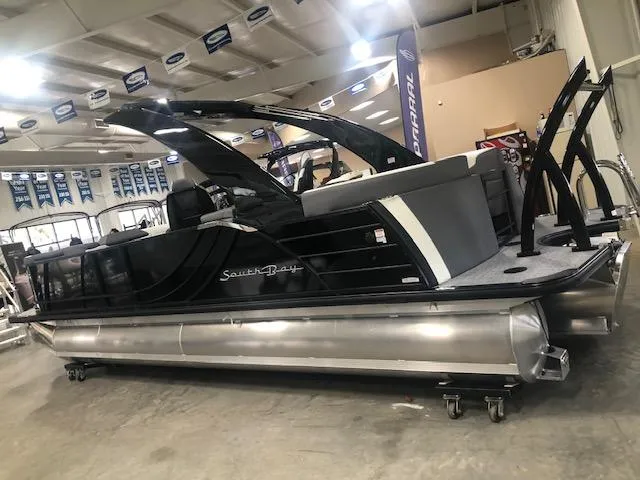 Slide: The Image of 2023 South Bay 525 RS 3.0 Arch pontoon boat in showroom. - 2