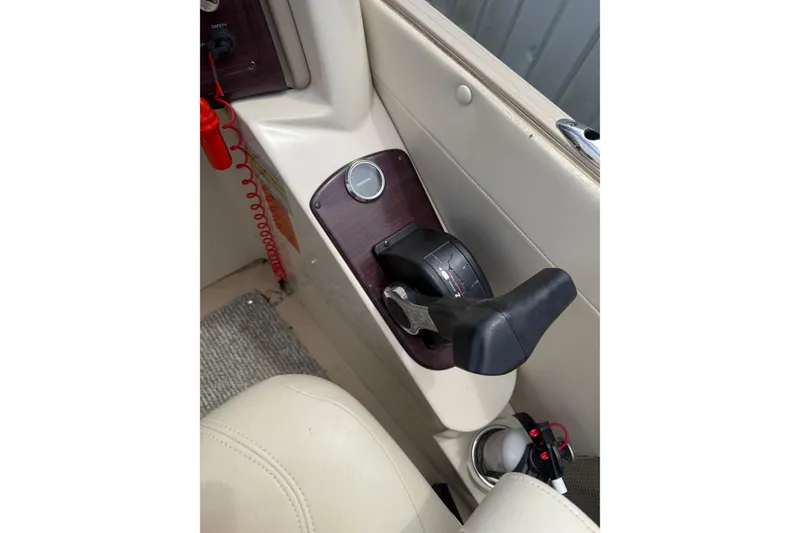 Slide: The Image of Control panel of 2008 Sylvan 8523 Mandalay RE boat with throttle lever. - 12