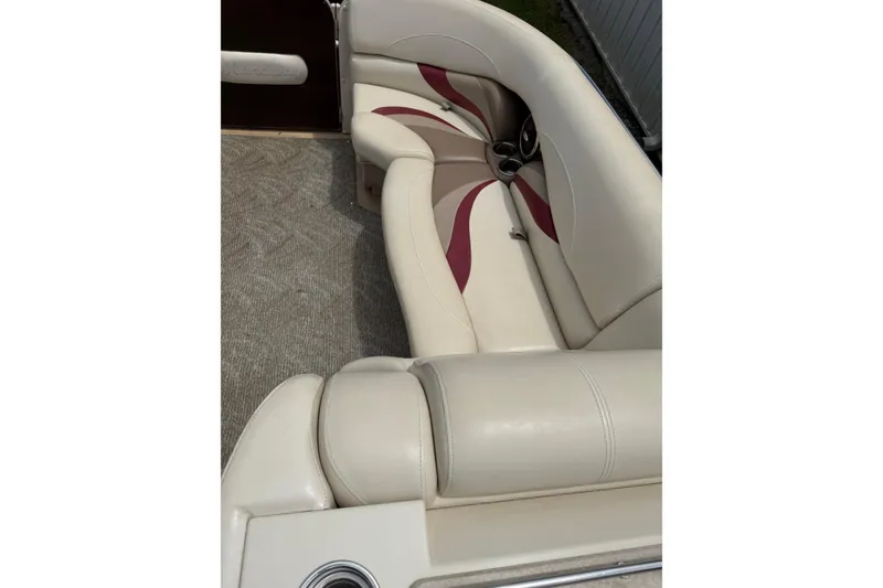 Slide: The Image of 2008 Sylvan 8523 Mandalay RE boat interior with cream and maroon seating. - 14