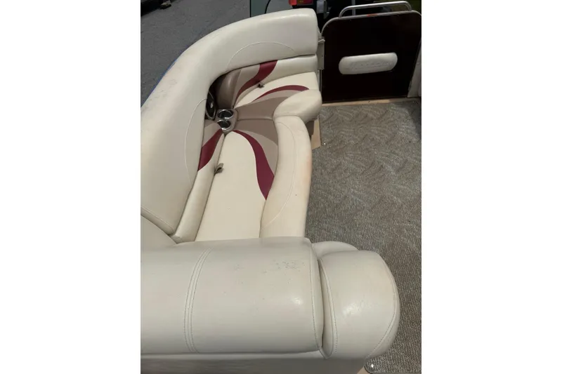 Slide: The Image of 2008 Sylvan 8523 Mandalay RE boat interior with beige and maroon seating. - 15