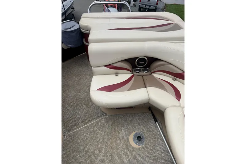 Slide: The Image of 2008 Sylvan 8523 Mandalay RE boat interior with beige and maroon seating. - 27