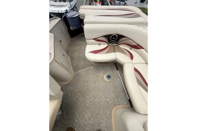Slide: The Image of Interior of a 2008 Sylvan 8523 Mandalay RE pontoon boat with beige seating. - 28