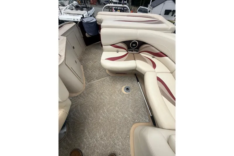 Slide: The Image of Interior of a 2008 Sylvan 8523 Mandalay RE pontoon boat with beige seating. - 29
