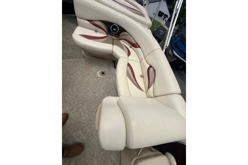 Slide: The Image of Luxurious seating on 2008 Sylvan 8523 Mandalay RE boat, featuring cream and maroon upholstery. - 30