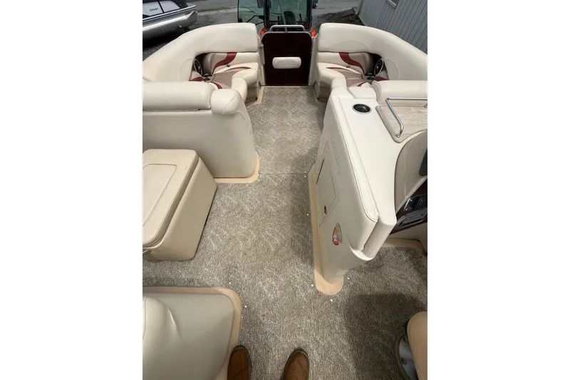 Slide: The Image of Interior of 2008 Sylvan 8523 Mandalay RE pontoon boat with beige seating and carpet. - 31