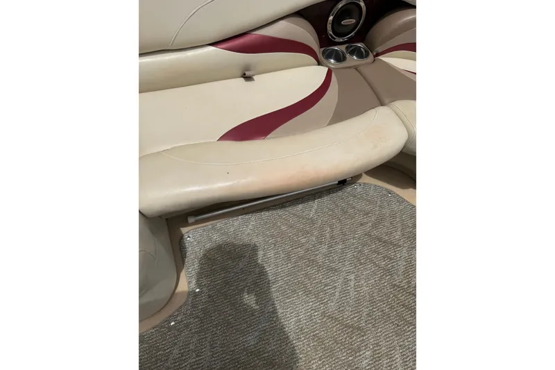 Slide: The Image of Interior seating of 2008 Sylvan 8523 Mandalay RE with cup holders and carpeted floor. - 32