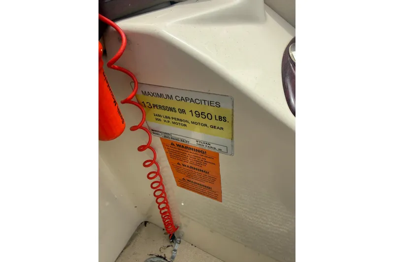 Slide: The Image of 2008 Sylvan 8523 Mandalay RE boat capacity label, maximum 13 persons or 1950 lbs. - 34