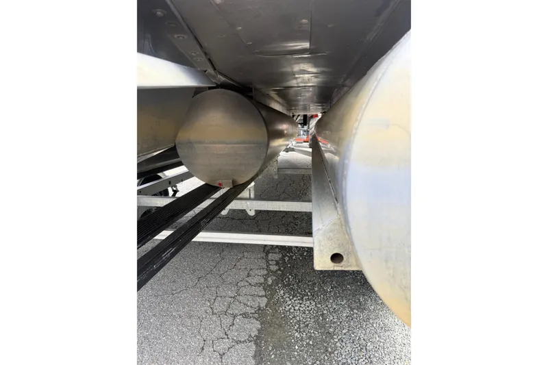 Slide: The Image of Underneath view of a 2008 Sylvan 8523 Mandalay RE pontoon boat on a trailer. - 35