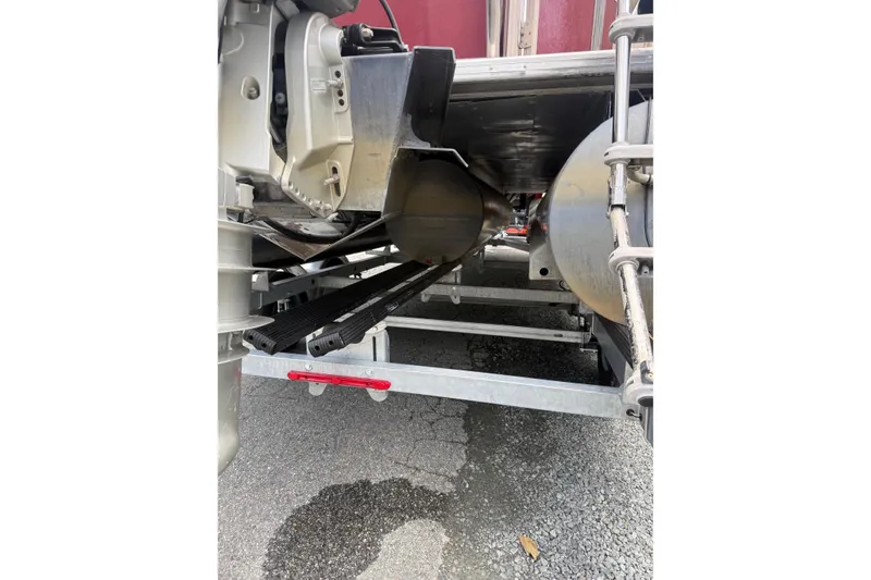 Slide: The Image of Underneath view of a 2008 Sylvan 8523 Mandalay RE pontoon boat on a trailer. - 36
