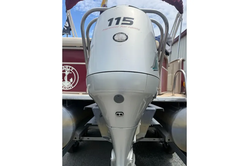 Slide: The Image of Outboard motor on 2008 Sylvan 8523 Mandalay RE pontoon boat, showcasing engine details. - 38