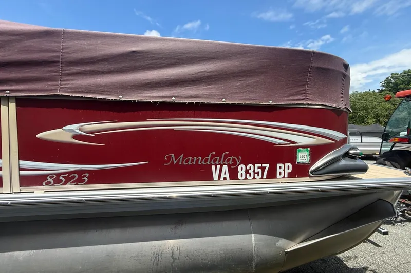 Slide: The Image of 2008 Sylvan 8523 Mandalay RE pontoon boat with maroon cover and registration details. - 5