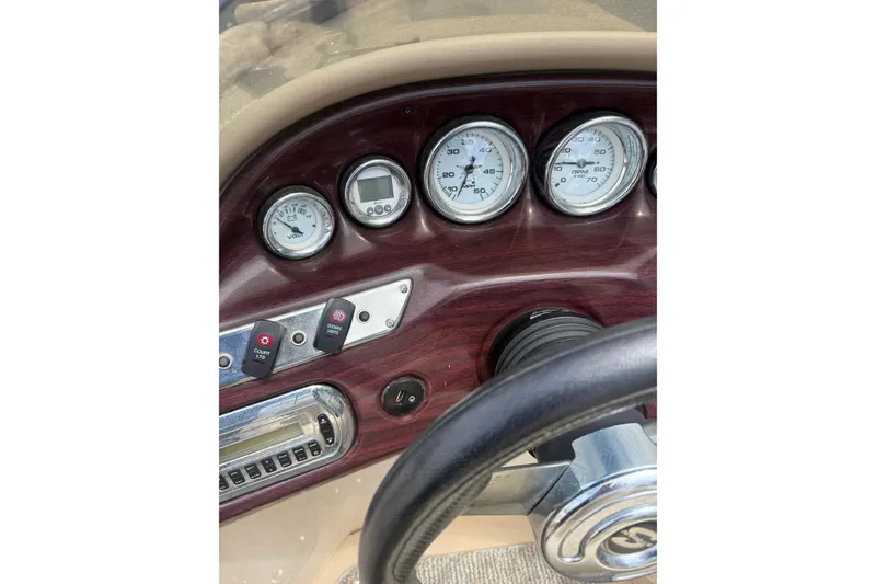 Slide: The Image of Dashboard of a 2008 Sylvan 8523 Mandalay RE boat with gauges and controls. - 9