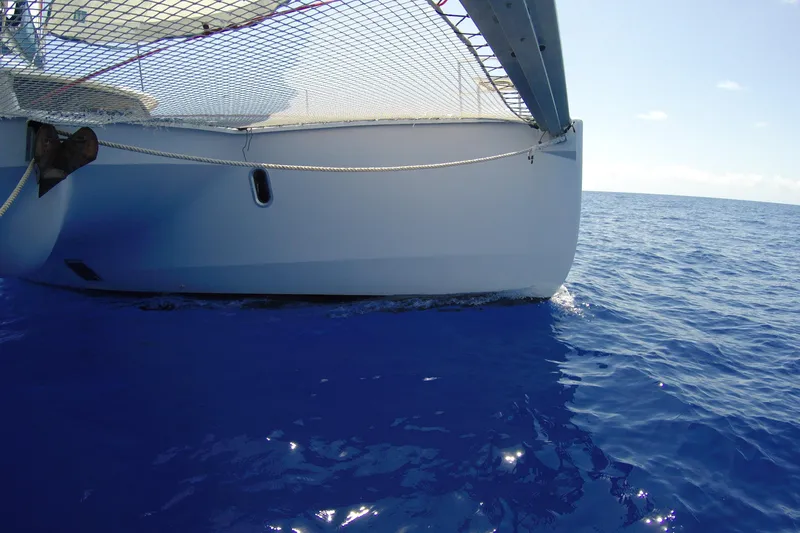 Slide: The Image of 2009 Fountaine Pajot Orana 44 catamaran sailing on clear blue ocean waters. - 11