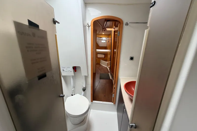 Slide: The Image of Interior of 2009 Fountaine Pajot Orana 44 yacht bathroom with red sink and toilet. - 23