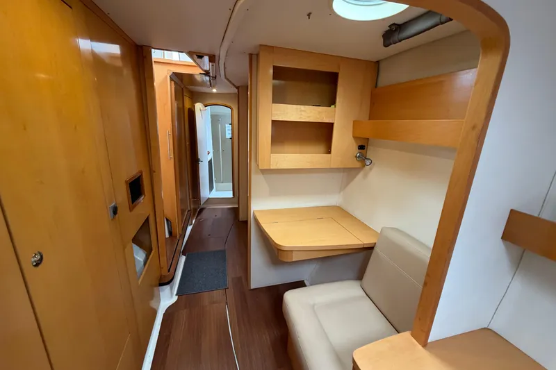 Slide: The Image of Interior of 2009 Fountaine Pajot Orana 44 catamaran with wooden cabinetry and seating area. - 28