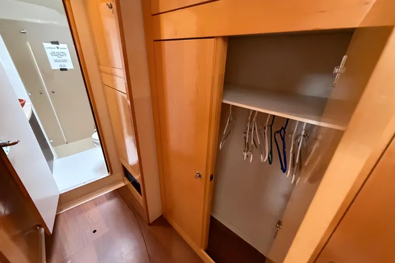 Slide: The Image of Interior of 2009 Fountaine Pajot Orana 44 yacht showing wooden closet and bathroom. - 30