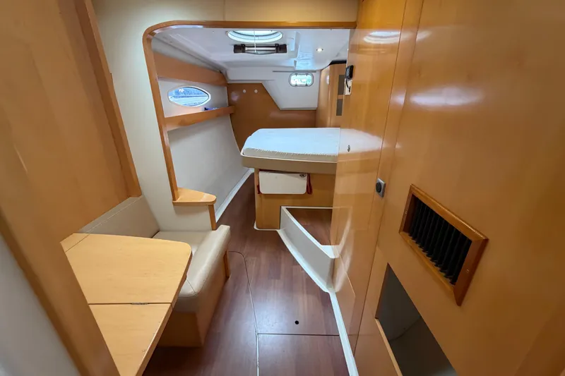 Slide: The Image of 2009 Fountaine Pajot Orana 44 interior cabin with wooden furnishings and cozy seating area. - 31