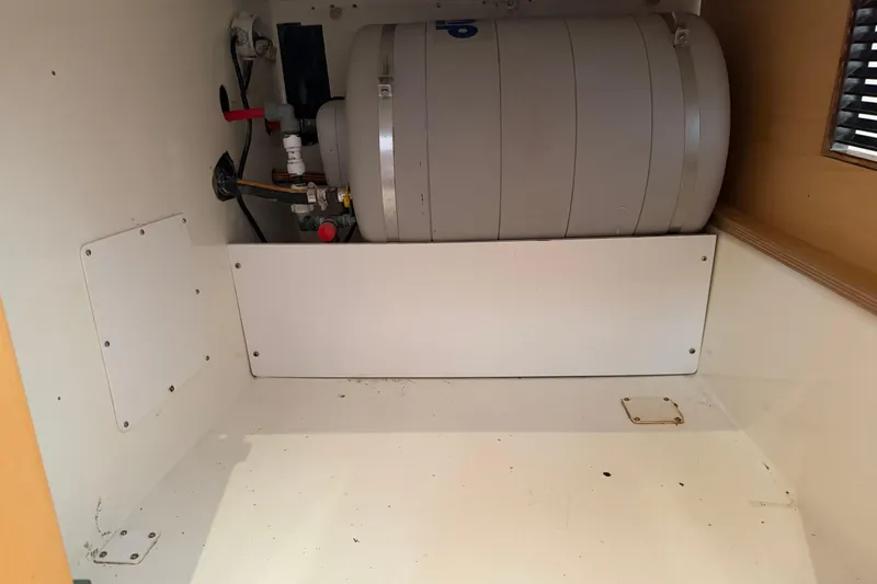 Slide: The Image of Storage compartment in a 2009 Fountaine Pajot Orana 44 catamaran, featuring a cylindrical tank. - 34