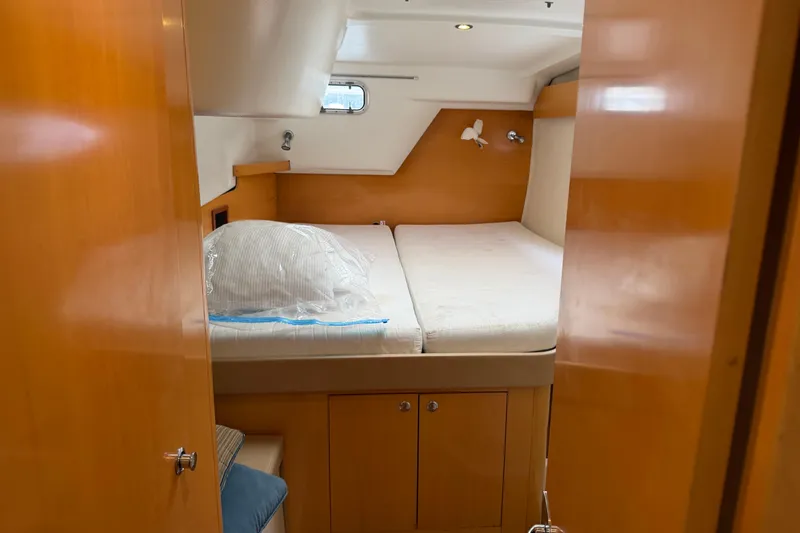 Slide: The Image of Cozy cabin interior of 2009 Fountaine Pajot Orana 44 catamaran with wooden finishes. - 35