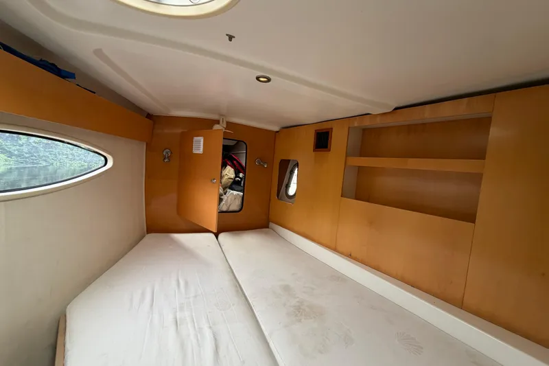 Slide: The Image of Interior cabin of 2009 Fountaine Pajot Orana 44 catamaran with wooden shelves and bed. - 37
