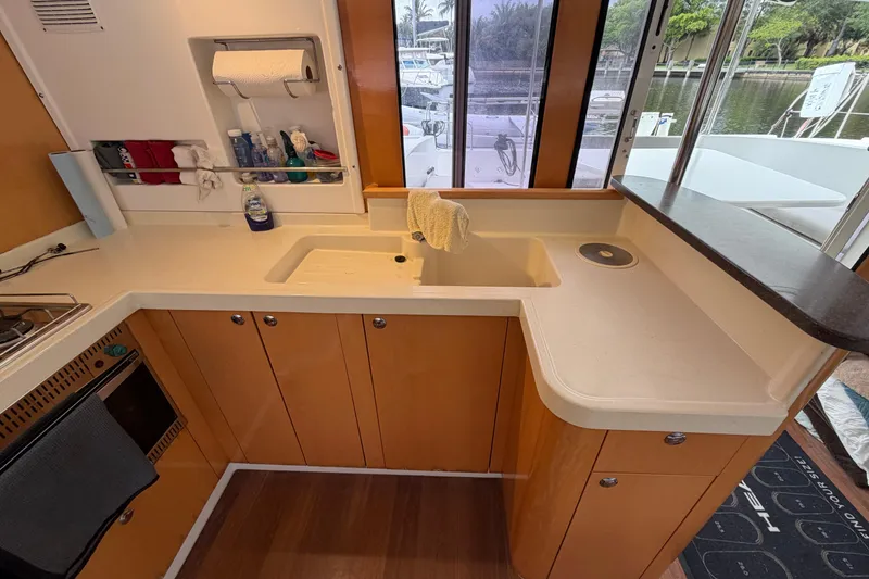 Slide: The Image of 2009 Fountaine Pajot Orana 44 yacht kitchen with modern amenities and large windows. - 42