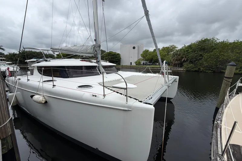 Slide: The Image of 2009 Fountaine Pajot Orana 44 catamaran docked on a cloudy day. - 48