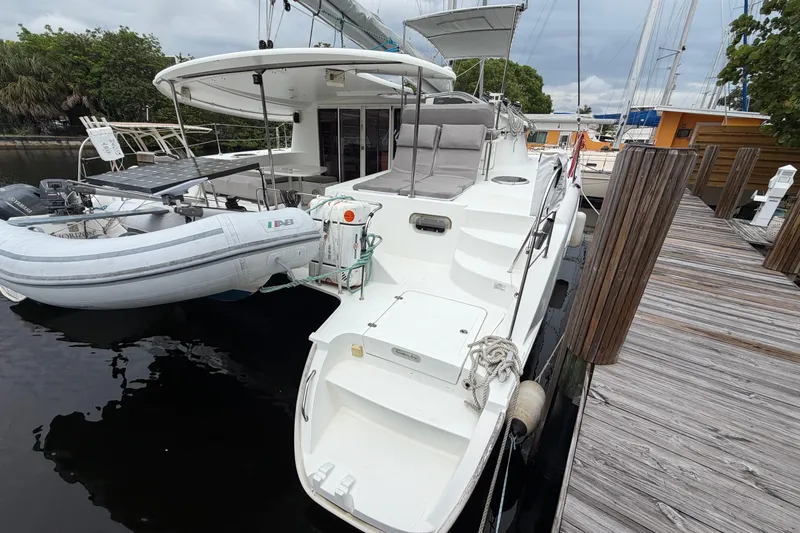 Slide: The Image of 2009 Fountaine Pajot Orana 44 catamaran docked with inflatable dinghy attached. - 50