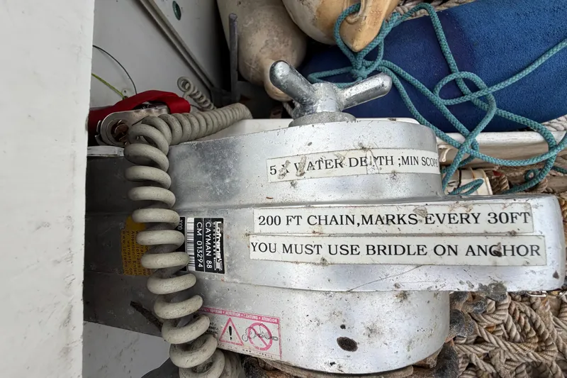 Slide: The Image of Anchor windlass with safety instructions on a 2009 Fountaine Pajot Orana 44 catamaran. - 59