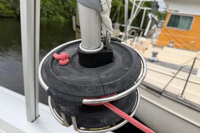 Slide: The Image of Close-up of a 2009 Fountaine Pajot Orana 44 sailboat winch with red rope. - 60