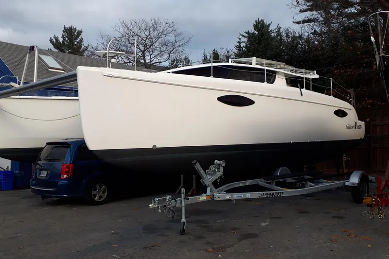 Slide: The Image of 2009 Fountaine Pajot Orana 44 catamaran on trailer, parked beside a blue vehicle. - 7
