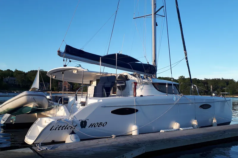 Slide: The Image of 2009 Fountaine Pajot Orana 44 catamaran docked, featuring sleek design and spacious deck. - 8