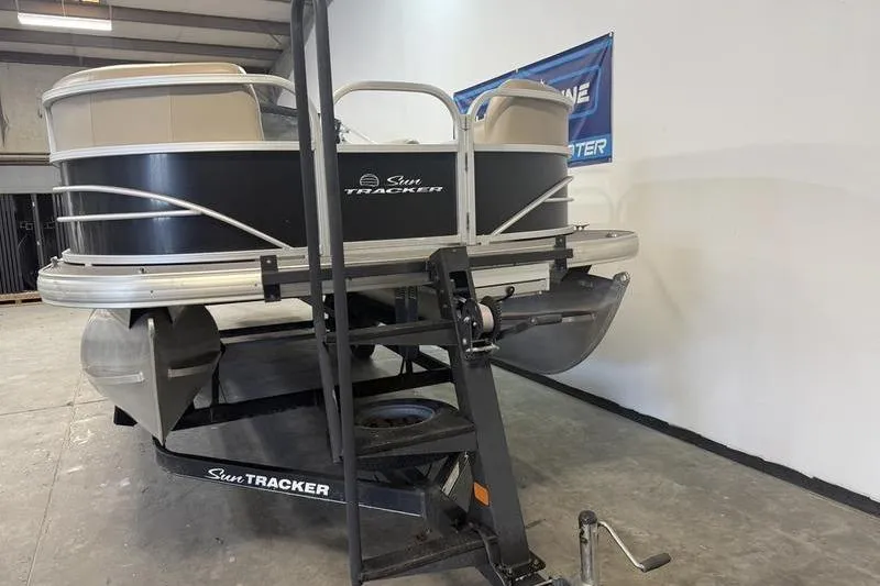 Slide: The Image of 2017 Sun Tracker Party Barge 22 DLX pontoon boat on trailer in warehouse. - 3