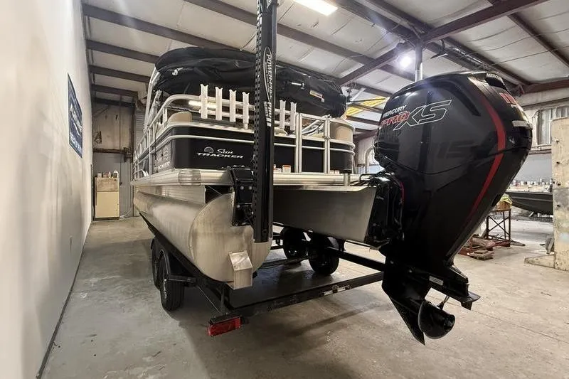 Slide: The Image of 2017 Sun Tracker Party Barge 22 DLX with Mercury Pro XS engine in a warehouse. - 4