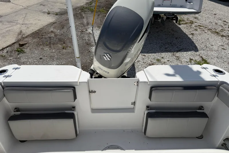 Slide: The Image of 2022 Aquasport 2300 Center Console boat with Suzuki outboard motor, featuring rear seating. - 8