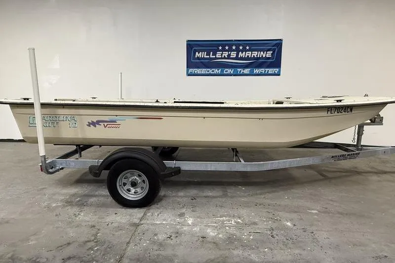 The Image of 1998 Carolina Skiff 1965 V boat on trailer at Miller's Marine showroom. - 0