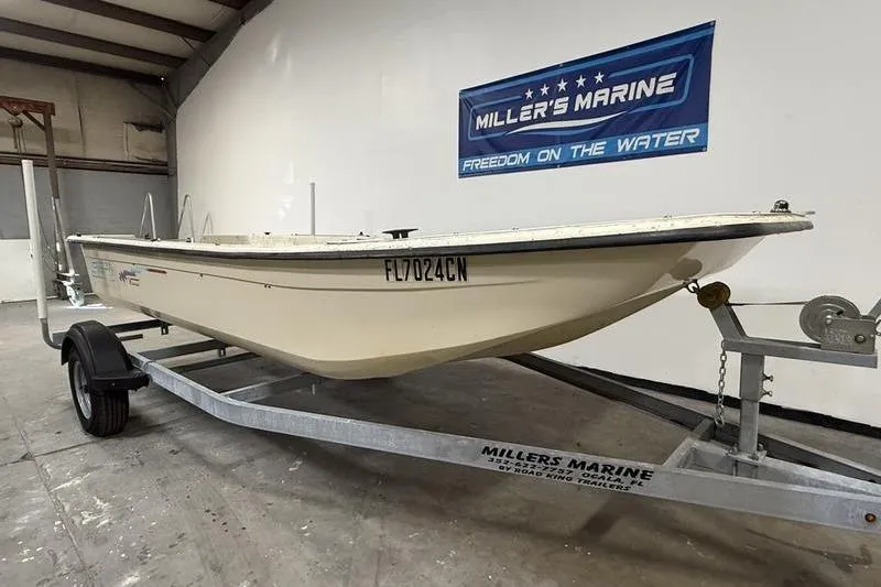 Slide: The Image of 1998 Carolina Skiff 1965 V boat on trailer at Miller's Marine showroom. - 1
