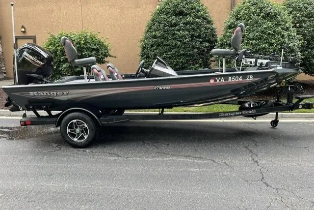 The Image of 2025 Ranger RT178 fishing boat on trailer, parked outdoors. - 1