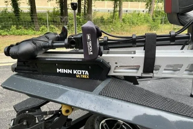 Slide: The Image of 2025 Ranger RT178 boat with Minn Kota Ultrex trolling motor, parked outdoors. - 3