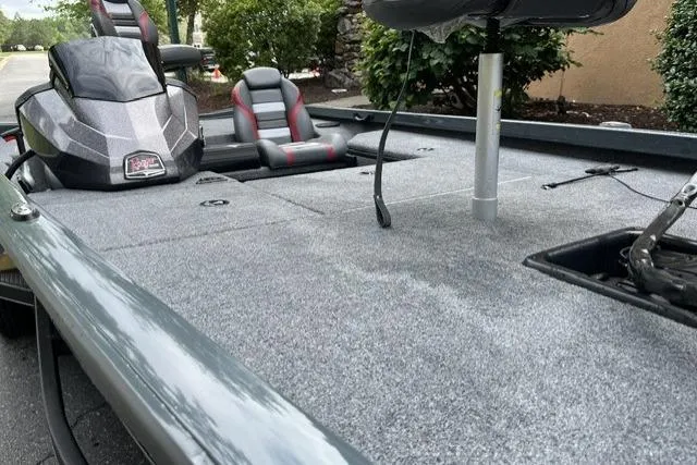 Slide: The Image of 2025 Ranger RT178 boat interior with gray carpet and seating. - 4