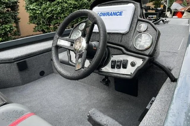 Slide: The Image of 2025 Ranger RT178 boat cockpit with steering wheel and Lowrance display. - 5