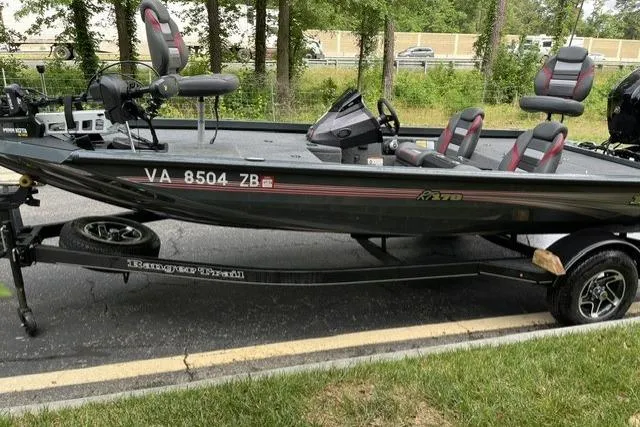 Slide: The Image of 2025 Ranger RT178 fishing boat on trailer, parked on roadside. - 9