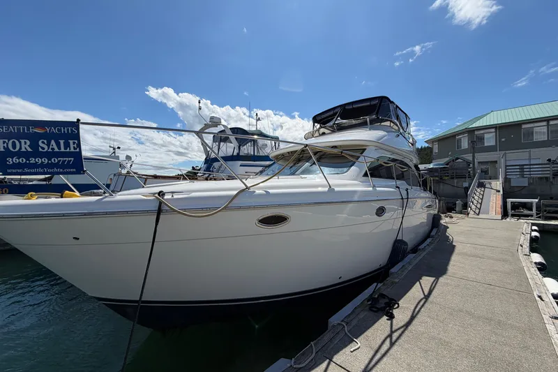 The Image of 2004 Meridian 411 Sedan yacht docked, for sale by Seattle Yachts, under clear skies. - 0