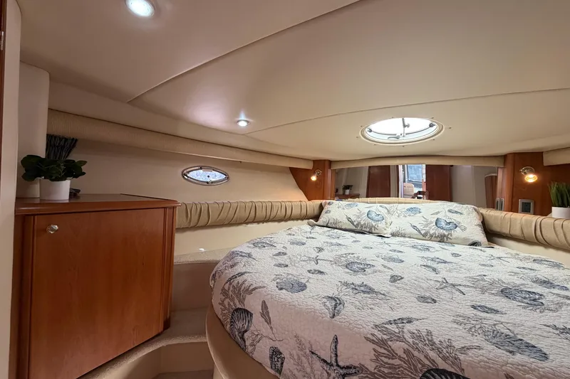 Slide: The Image of Luxurious 2004 Meridian 411 Sedan cabin with cozy bed and elegant wood cabinetry. - 18