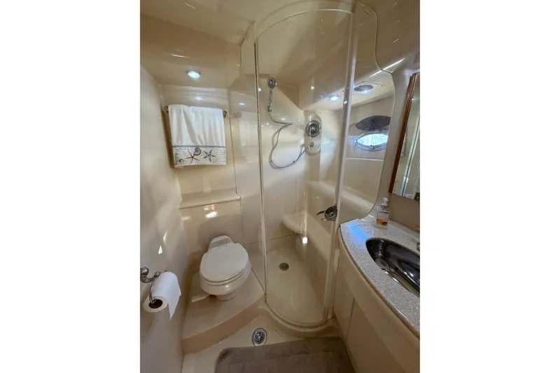 Slide: The Image of Luxurious bathroom in 2004 Meridian 411 Sedan yacht with shower and vanity. - 22