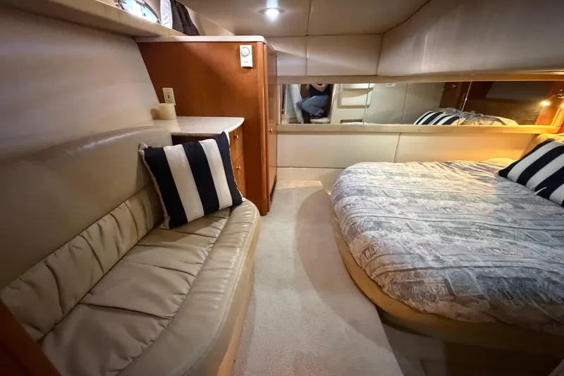 Slide: The Image of Luxurious interior of 2004 Meridian 411 Sedan yacht with cozy seating and bed. - 25